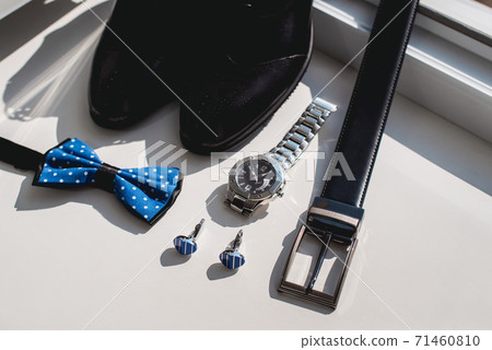 Black leather shoes and belt, watch, blue bow tie 71460810
