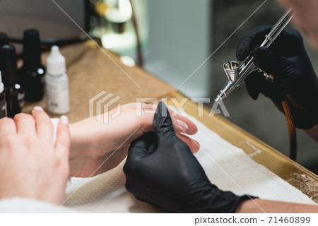 Closeup shot of a woman in a nail salon receiving 71460899