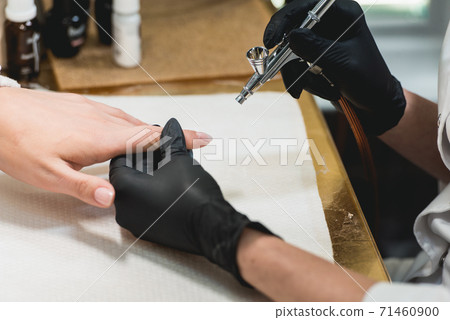 Closeup shot of a woman in a nail salon receiving Closeup shot of a woman in a nail salon receiving 71460900