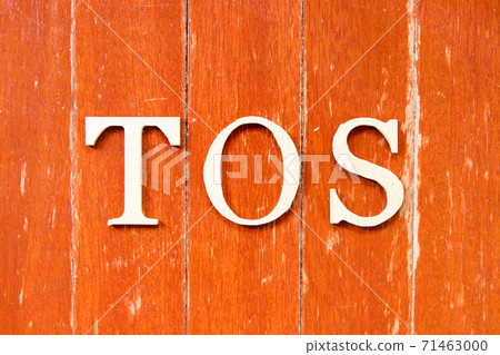 Alphabet letter in word TOS (abbreviation of Terms of service) on old red color wood plate background 71463000