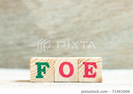 Alphabet letter in word foe on wood background Alphabet letter in word foe on wood background 71463006