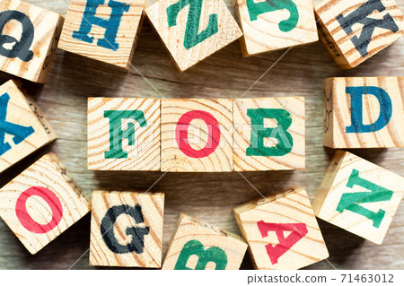 Alphabet letter block in word FOB (Abbreviation of Free on Board) with another on wood background Alphabet letter block in word FOB (Abbreviation of Free on Board) with another on wood background 71463012
