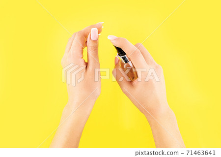 Concept of COVID-19 outbreak protection with antiseptic. Woman using hand sanitizer or antiseptic gel as prevention measure for coronavirus Concept of COVID-19 outbreak protection with antiseptic. Woman using hand sanitizer or antiseptic gel as prevention measure for coronavirus 71463641