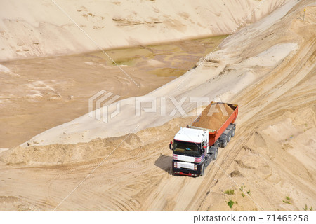 Truck with tipper semi trailer transported sand from the quarry. Dump truck Truck with tipper semi trailer transported sand from the quarry. Dump truck 71465258