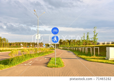 Footpath and bicycle path sign in city at pedestrian zone. Footpath and bicycle path sign in city at pedestrian zone. 71465282
