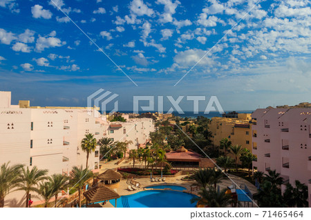 View of the luxurious hotel with a swimming pool and Red sea 71465464