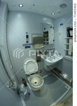 Toilet in Railways First Class sleeping carriage of a passenger train, toilet bowl, washbasin, mirrors and paper box Toilet in Railways First Class sleeping carriage of a passenger train, toilet bowl, washbasin, mirrors and paper box 71465469
