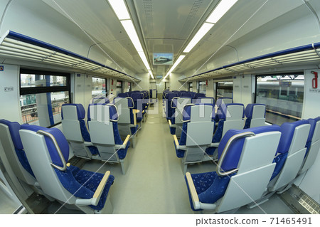 Empty 2 class compartment of wagon of commuter train, seats and doors 71465491