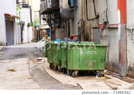 A row of garbage cans in the corner. Desert Dirty Lane A row of garbage cans in the corner. Desert Dirty Lane 71466362