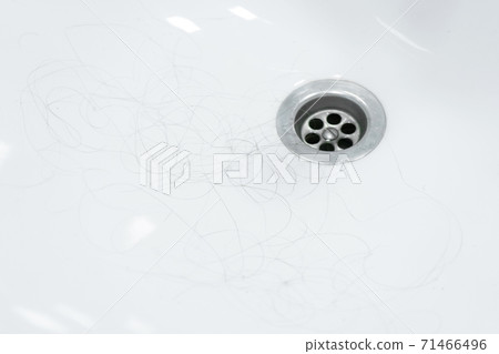Hair loss. Hair in the sink after combing the head 71466496