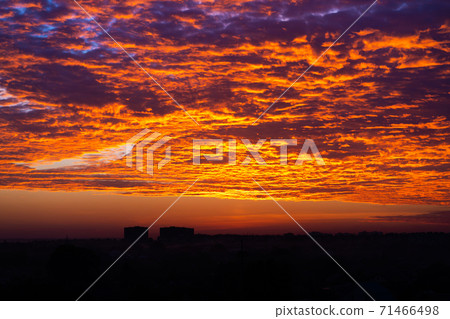 The colors of a burning sunset in the sky The colors of a burning sunset in the sky 71466498