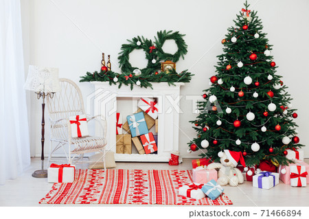 Christmas tree pine with fireplace interior of the house new year decor gifts vacation 71466894
