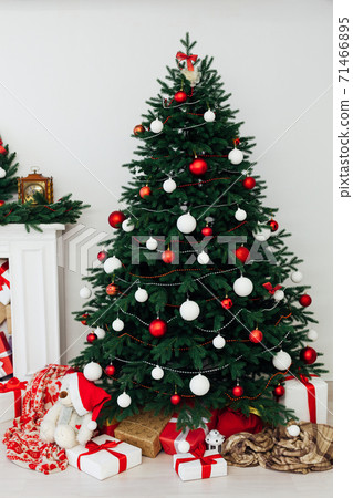 Christmas tree pine with fireplace interior of the house new year decor gifts vacation 71466895