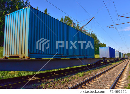 Cargo containers transportation on freight train by railway.  71469351