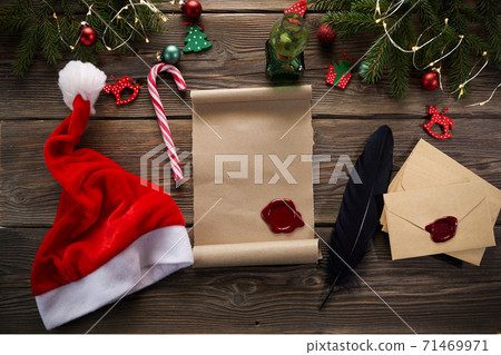 Empty wishlist for Santa Claus on wooden table with Christmas decorations. Top view. 71469971