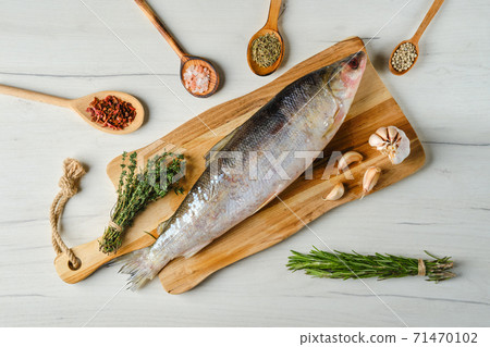 Overhead view of raw frozen unpeeled omul Overhead view of raw frozen unpeeled omul 71470102