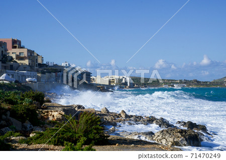 VALLETTA, MALTA - DEC 31st, 2019: West coast of Malta Island. The way from Mellieha to Golden Bay with waves on the shore 71470249