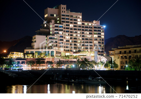 FUJAIRAH, UNITED ARAB EMIRATES - NOV 07th, 2017: View of the luxury beach hotel during night with black sky in the background FUJAIRAH, UNITED ARAB EMIRATES - NOV 07th, 2017: View of the luxury beach hotel during night with black sky in the background 71470252