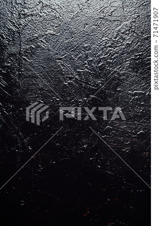 Old black paint vintage wall structure the texture of stone as a background Old black paint vintage wall structure the texture of stone as a background 71471907