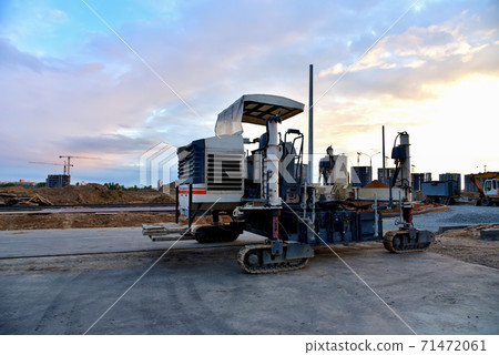 Slipform paver machine on road work at construction site. Slipform paver machine on road work at construction site. 71472061