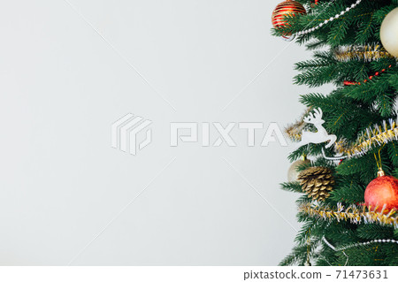 Christmas and New Year decorated interior room. Holiday decorated room with bed on window sill. Festive Christmas and New Year decorated interior room. Holiday decorated room with bed on window sill. Festive 71473631