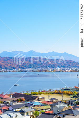 Lake Suwa seen from Okaya City (Yatsugatake mountain range in the distance) Lake Suwa seen from Okaya City (Yatsugatake mountain range in the distance) 71473702