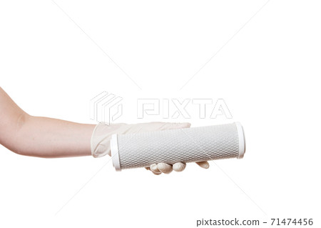 reticulate cartridge filter for drinking water purification carbon mesh demonstrate holding in hand in sterile glove isolated on a white background with a copy space. reticulate cartridge filter for drinking water purification carbon mesh demonstrate holding in hand in sterile glove isolated on a white background with a copy space. 71474456