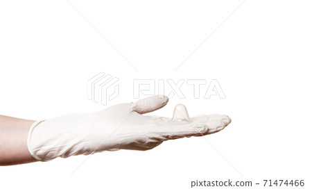 hand with glove hold contact nipple shield nippleshield for breastfeeding with latch difficulties or flat or inverted nipples, silicone nipple protectors isolated on white background with copy space. hand with glove hold contact nipple shield nippleshield for breastfeeding with latch difficulties or flat or inverted nipples, silicone nipple protectors isolated on white background with copy space. 71474466