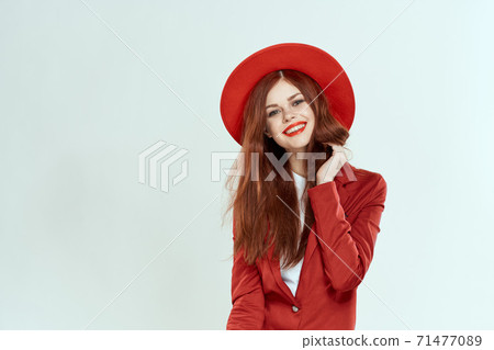 beautiful woman in red hat blazer makeup elegant style light background studio beautiful woman in red hat blazer makeup elegant style light background studio 71477089