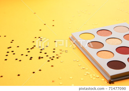 Eyeshadows on a yellow background professional cosmetics makeup brushes soft sponge fashion glasses Eyeshadows on a yellow background professional cosmetics makeup brushes soft sponge fashion glasses 71477090