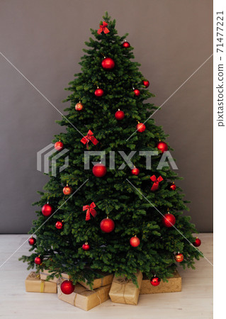 Interior Christmas tree with gifts for new year holiday decor Interior Christmas tree with gifts for new year holiday decor 71477221
