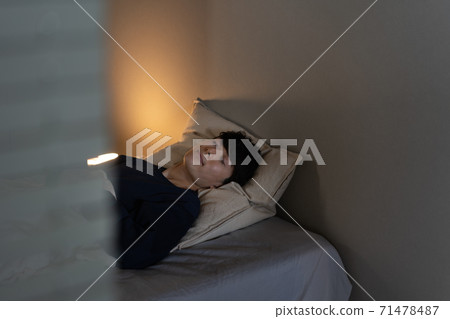Man sleeping in the bedroom Man sleeping in the bedroom 71478487