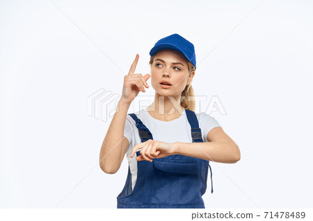 Working woman in blue cap uniform lifestyle emotions service light background 71478489