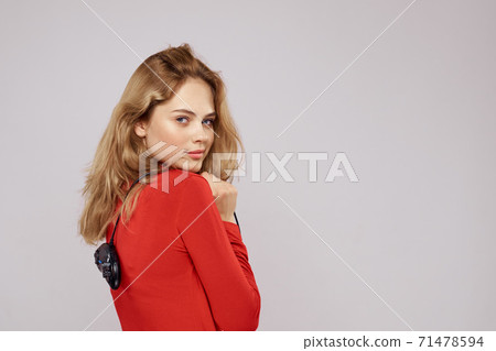 Pretty woman with gamepads playing entertainment leisure lifestyle light background Pretty woman with gamepads playing entertainment leisure lifestyle light background 71478594