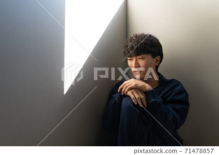 Young man withdrawing into the room Young man withdrawing into the room 71478857