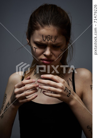 Woman with inscriptions on body frustration stress emotions lifestyle gray background Woman with inscriptions on body frustration stress emotions lifestyle gray background 71479226
