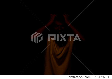 Man gestures with his hands emotions displeasure white t-shirt blue background 71479791