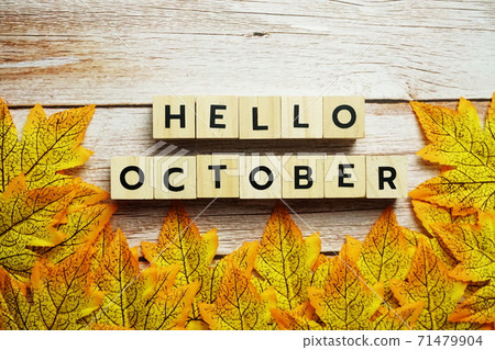Happy October alphabet letter with maple leaves decoration on wooden background Happy October alphabet letter with maple leaves decoration on wooden background 71479904