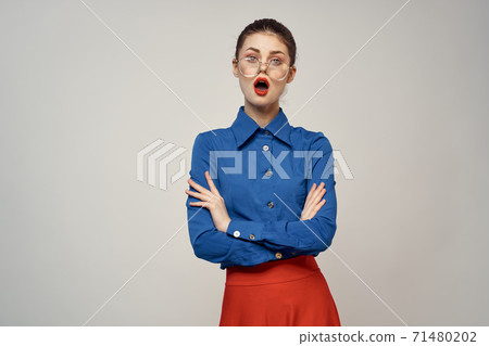 woman model in blue shirt and red skirt glasses beautiful face makeup studio 71480202