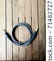 guitar cable connectors on wood 71482727