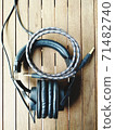 headphones cables on wood table 2 71482740