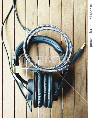 headphones cables on wood table 2 headphones cables on wood table 2 71482740