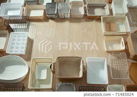 Top view of closet organization boxes and steel wire baskets in different shapes. 71483024