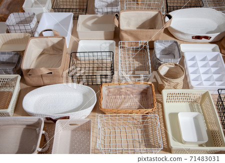 Flat lay of Marie Kondo's storage boxes, containers and baskets with different sizes and shapes Flat lay of Marie Kondo's storage boxes, containers and baskets with different sizes and shapes 71483031