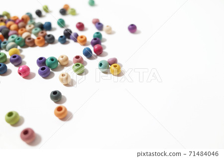 Scattered colorful wooden beads Scattered colorful wooden beads 71484046