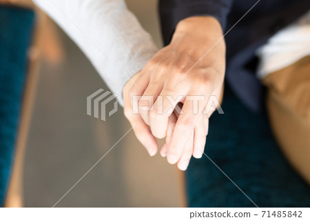 Two people holding hands on a date photo material 71485842