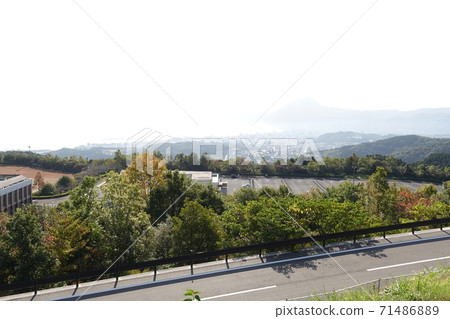 Scenery of Higashikyushu Expressway Beppu SA / SIC Mt. Takasaki in the distance of Beppu Bay 71486889