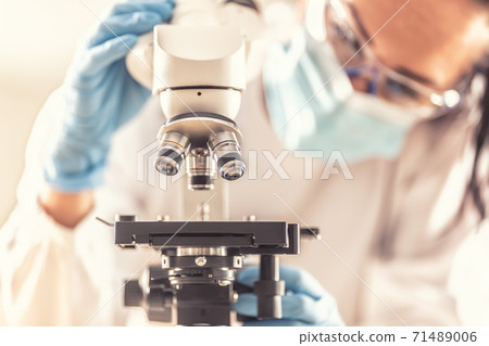 Detail of a microscope used by medical researcher in race to find cure for the Covid-19 disease 71489006