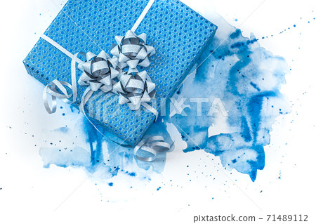 Beautiful blue gift box on watercolor background 71489112