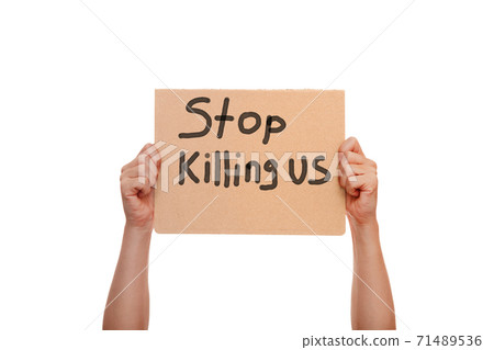 protest poster with the message Stop Killing Us, holding demonstration cardboard with text in hands isolated on a white background, a cononept for theme events in Minneapolis. protest poster with the message Stop Killing Us, holding demonstration cardboard with text in hands isolated on a white background, a cononept for theme events in Minneapolis. 71489536